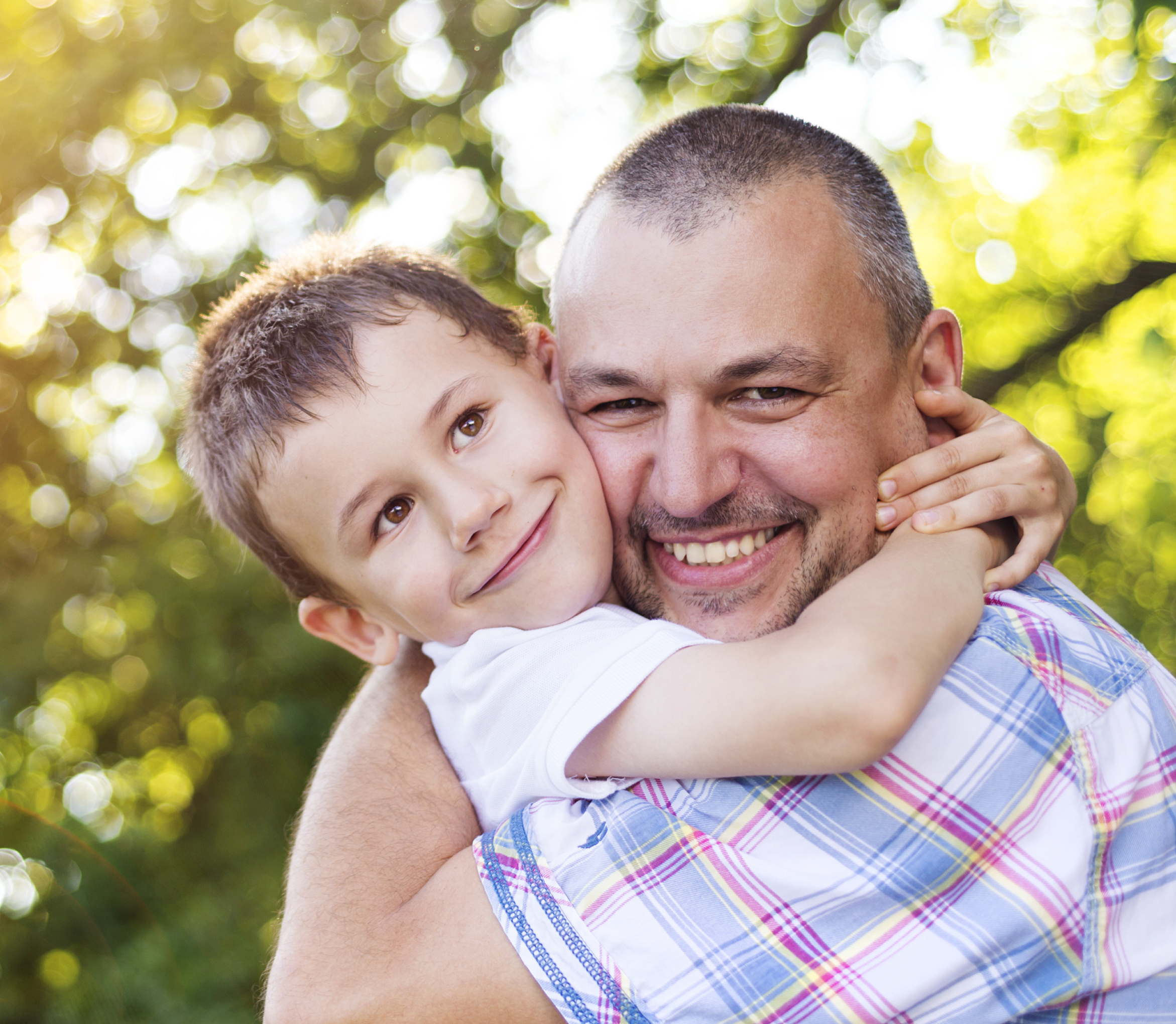 Father and Son with Arms Wrapped around each other